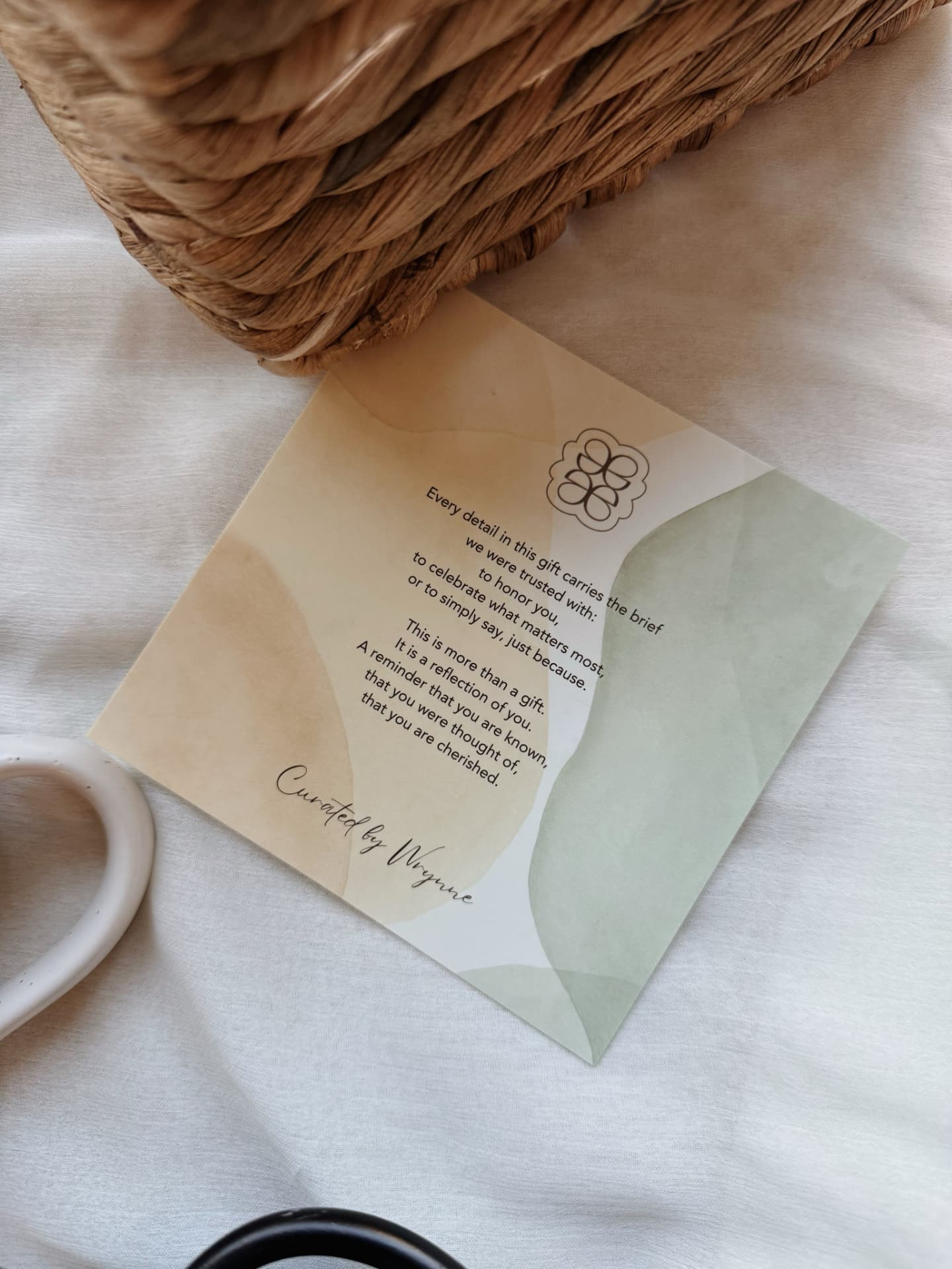 Wrynne card photographed with gift presentation details