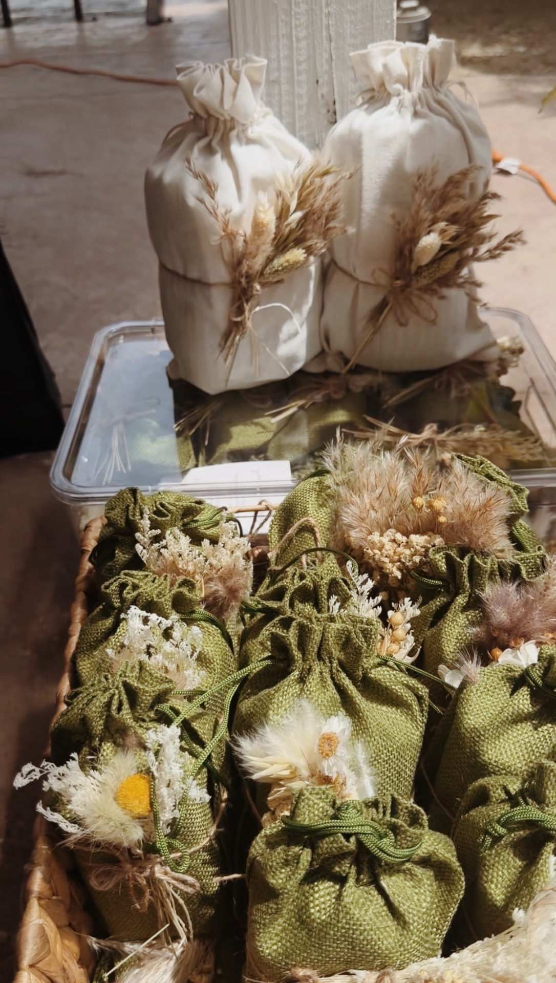 Green burlap favor pouches prepared for a Mother's Day brunch