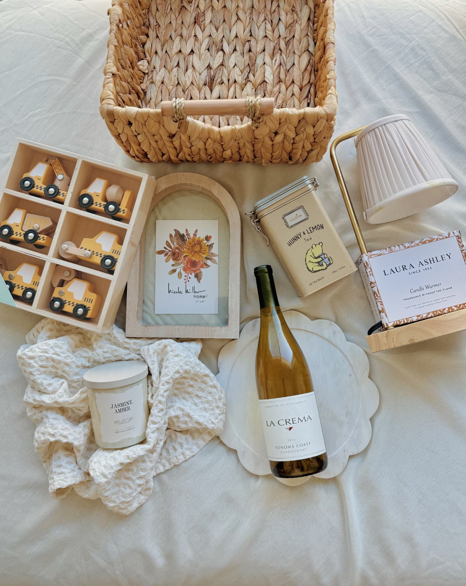 Family housewarming gift curated by Wrynne with home pieces, wine and gifts for a child